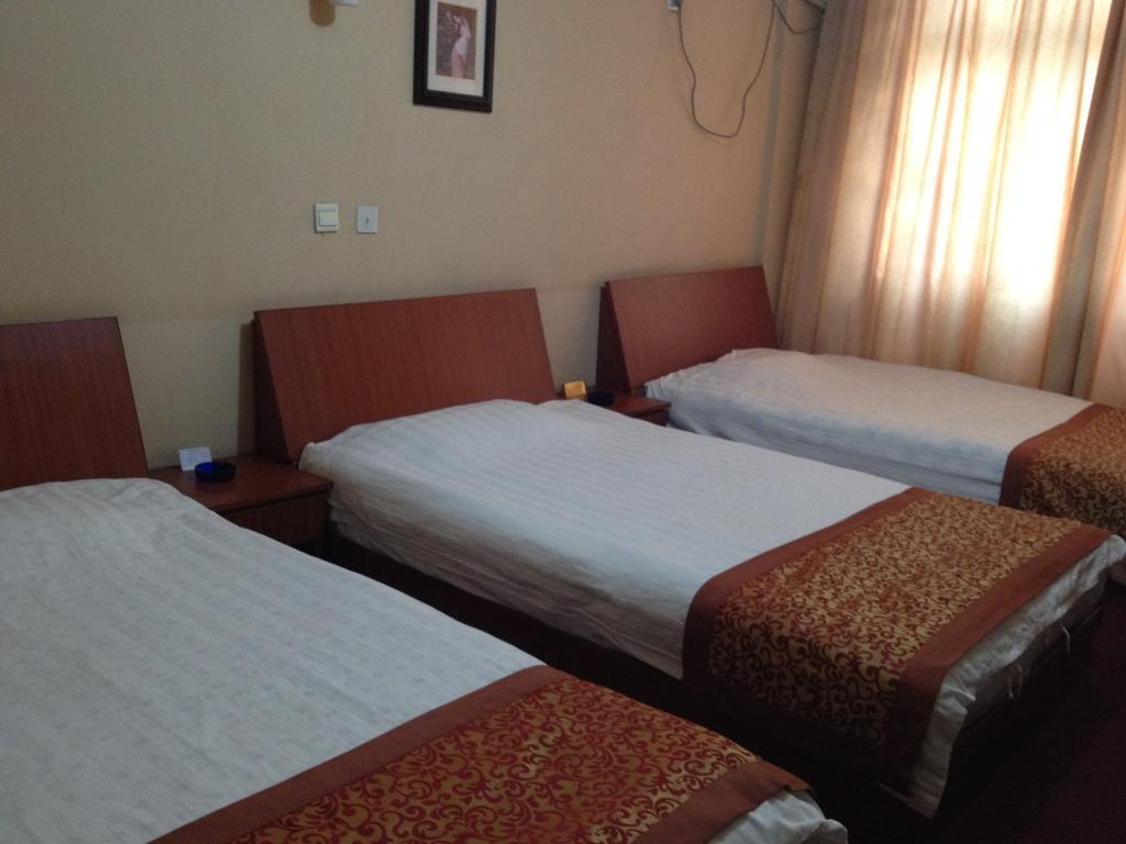 Huike Hotel Τζινάν Δωμάτιο φωτογραφία
